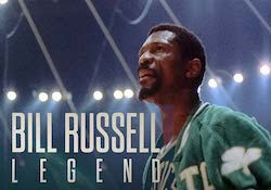 Bill Russell Legend Bill Russell stands under stadium lights in Boston Celtics uniform