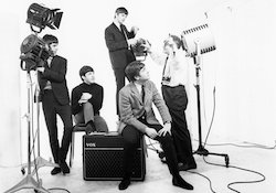 Photographer Dezo Hoffman directs staging for a portrait of the Beatles in the 1960s