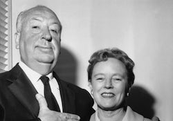Alfred and Alma Hitchcock pose for a picture together