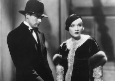 Cary Grant and Marlene Dietrich standing next to each other.