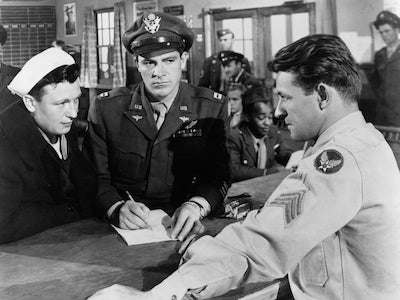 Three men in military uniform.