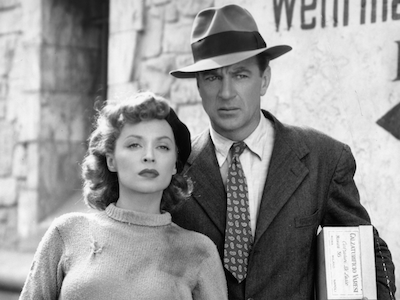 A woman and man standing outside.