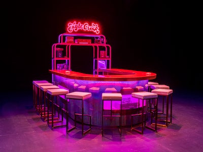A U-shaped bar table and chairs.