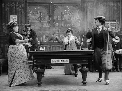 Women playing billiards.