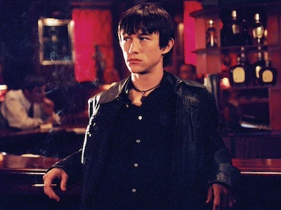 A man leaning on a bar.