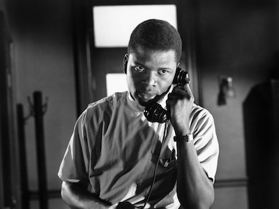 Sidney Poitier talking on the phone.