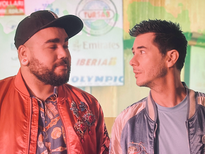 Two men looking at each other. 