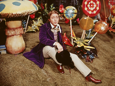 Willy Wonka among oversized candies and mushrooms.