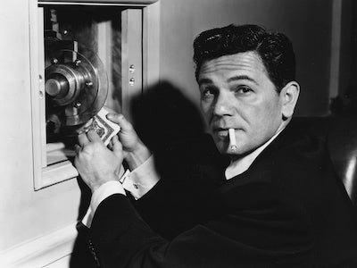 John Garfield breaking into a safe.