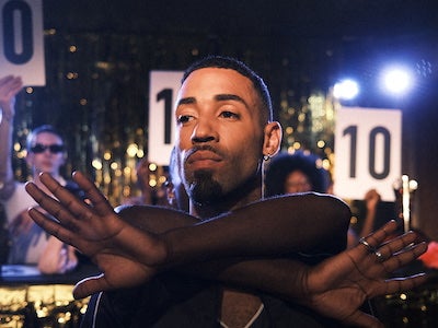 A person voguing in a ball.