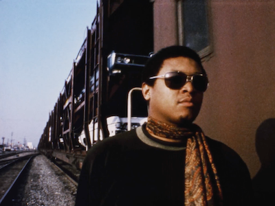 A man walking along a train.