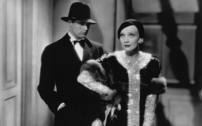 Cary Grant and Marlene Dietrich standing next to each other.