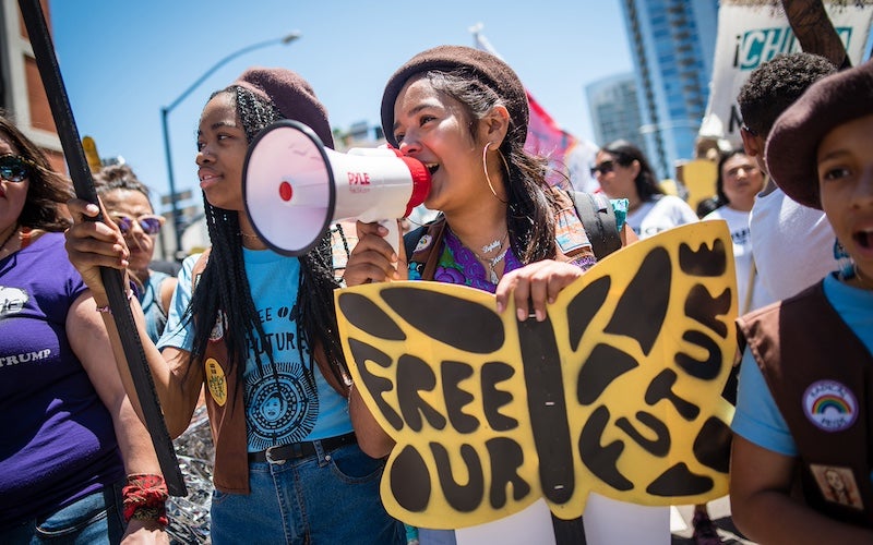 A group of girls participating in a protest.