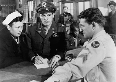 Three men in military uniform.