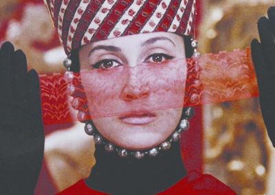 A woman holding a ribbon of lace in front of her face.