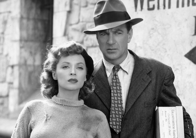 A woman and man standing outside.