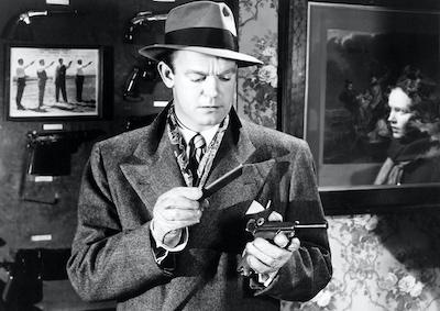 A man examining a gun.