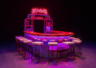 A U-shaped bar table and chairs.