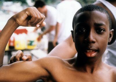 A boy flexing his arm.