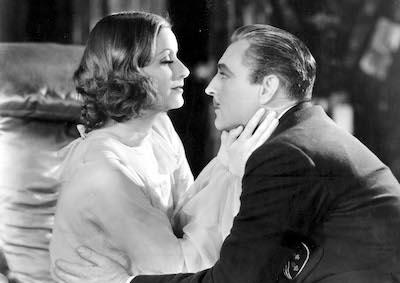 Greta Garbo and John Barrymore embracing.