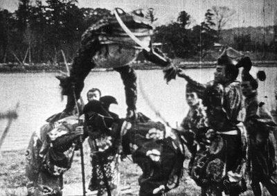 A group of swordsmen confronted by a giant toad.