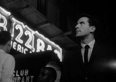 John Cassavetes in a night street scene.