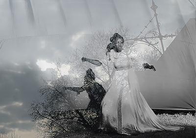 An ethereal image of two women in dresses among clouds.