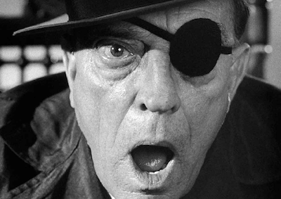 Closeup of Buster Keaton wearing an eyepatch.