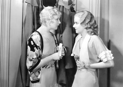 Jean Harlow talking to another actress.