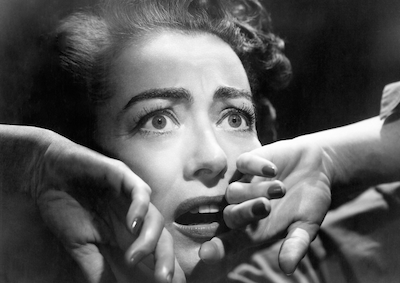 A frightened looking Joan Crawford.