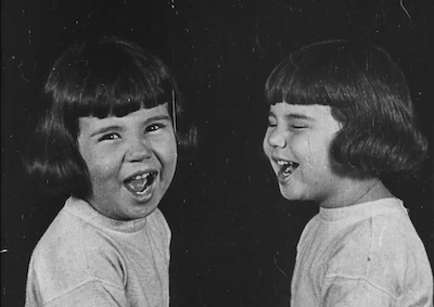 Two smiling Baby Peggys (as twins). 