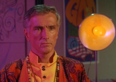 A man in psychedelic 60s clothing.