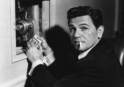 John Garfield breaking into a safe.