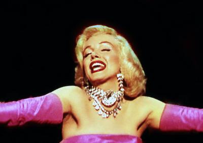 Marilyn Monroe in jewels and gloves.
