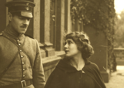 Mary Pickford looking at a man in military uniform.
