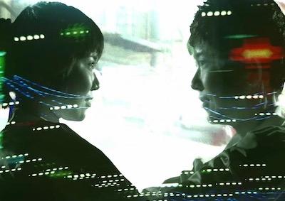 Two people smiling at each other.