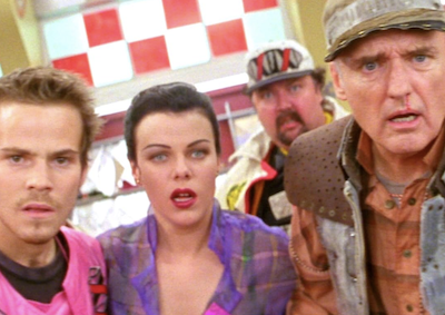 Four people looking dismayed.
