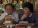 A man and a woman eating at a fast food restaurant.