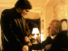 Two priests talking in a house.