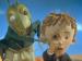 An animated grasshopper and a boy looking through a monocle.
