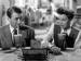 Actors James Steward and Jane Wyman drinking through straws at a counter.