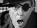 Closeup of Buster Keaton wearing an eyepatch.