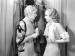Jean Harlow talking to another actress.