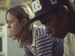 Actors Brie Larson and LaKeith Stanfield sitting side by side with serious expressions.