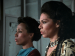 Two women shown in profile.
