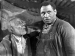 Paul Robeson standing next to a man.
