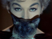 Closeup of Kim Novak and a cat's face.