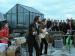 The Beatles performing on a roof.