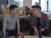 Elliott Page and Chase Strangio sitting together on a sofa.