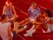 A group of people in athletic wear sitting on the floor.